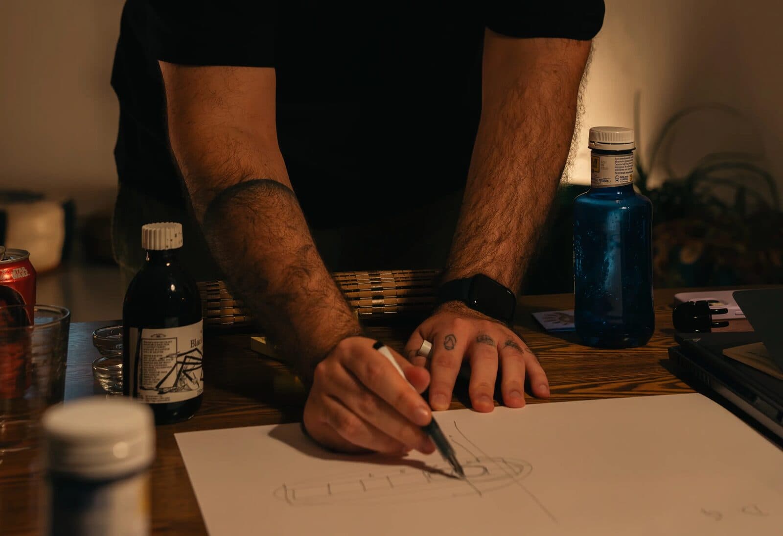 A hand sketching on paper